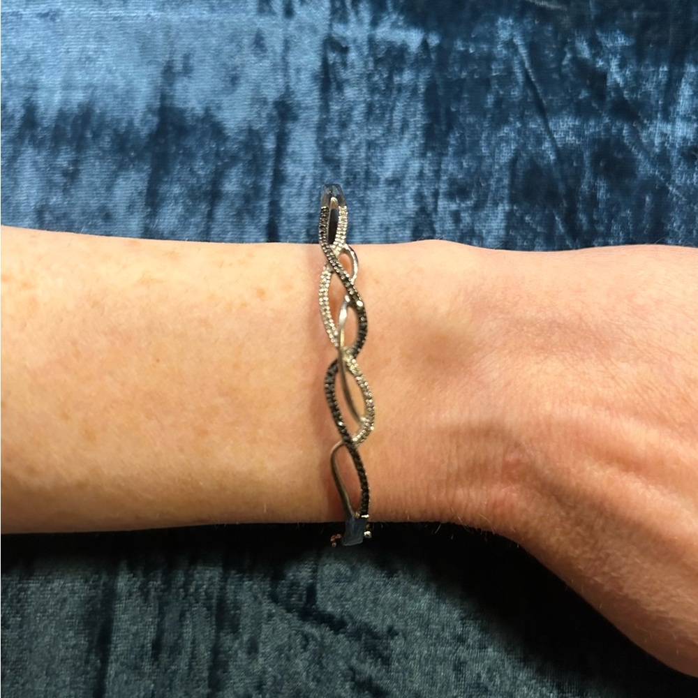Rush Bracelet - 1/5 CT. T.W. Diamond Intertwined Petite Bangle in St Silver